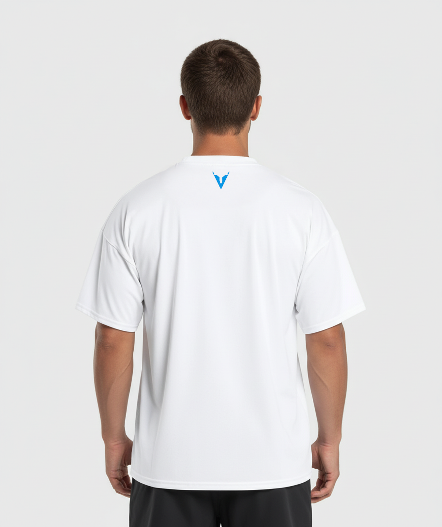 Person wearing a white t-shirt with a logo on the back against a light gray background