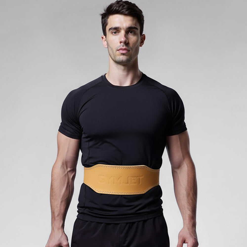 Man wearing a black t-shirt and shorts with a beige belt, holding a weight plate on a gray background