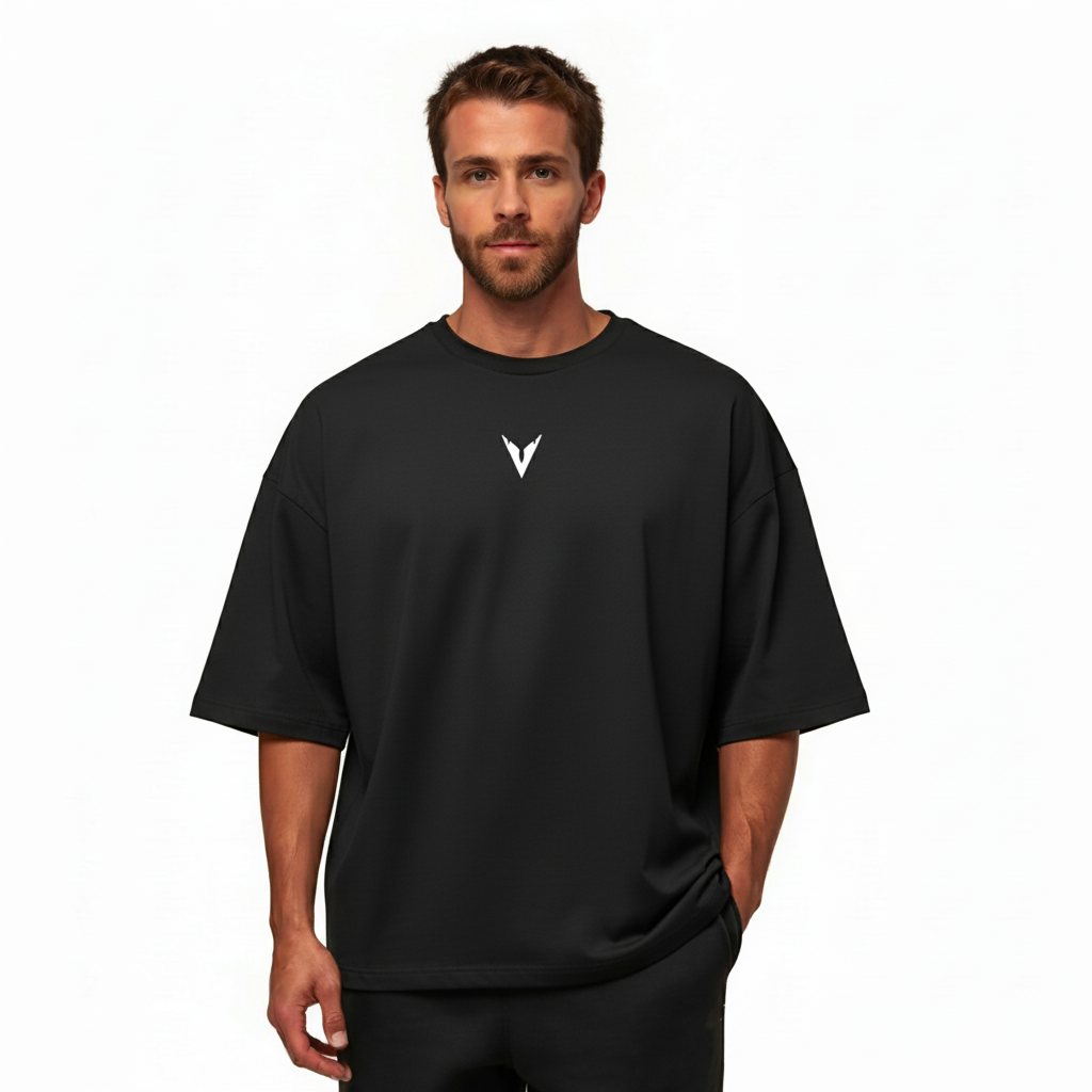 Man wearing a black t-shirt with a logo on a white background