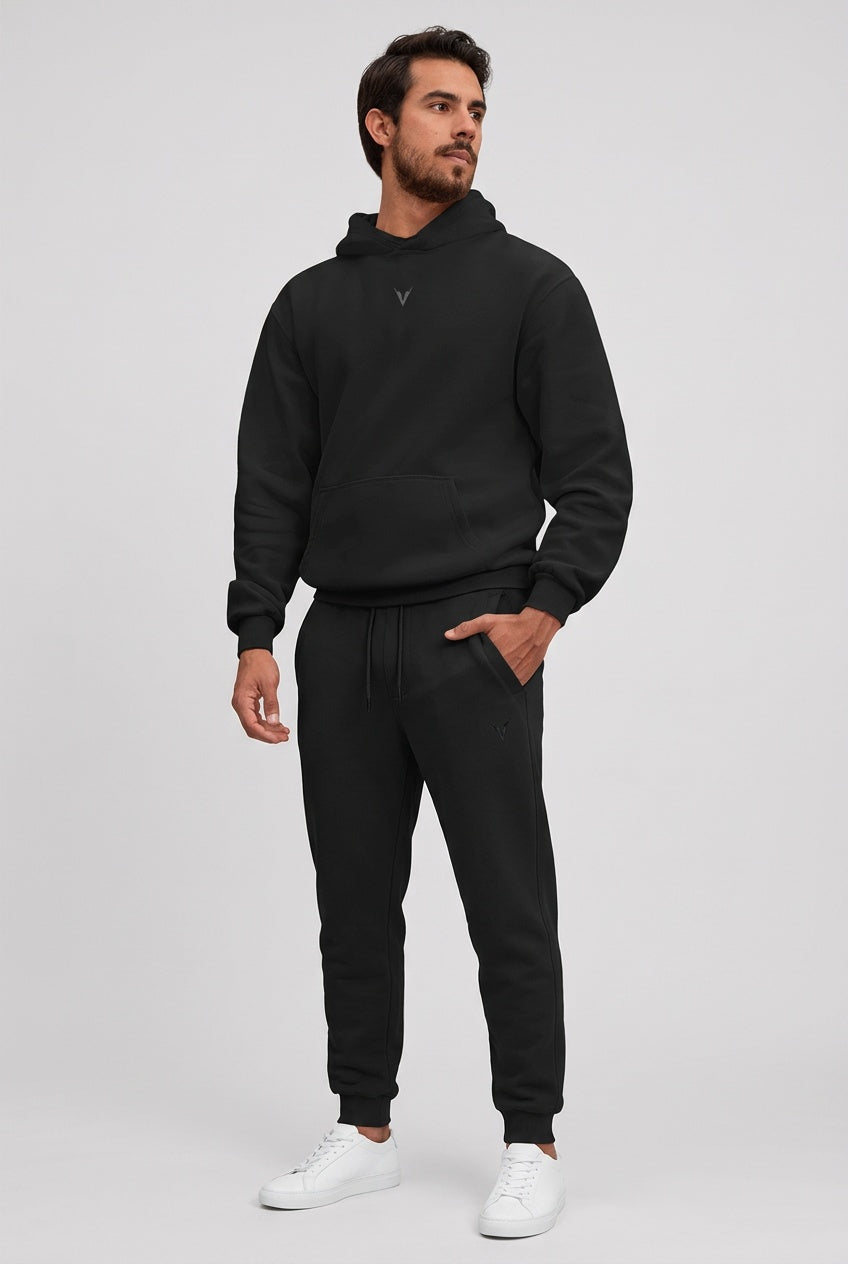 GYMJET Essential Fleece Set - Black, hoodie and sweatpants worn together on model