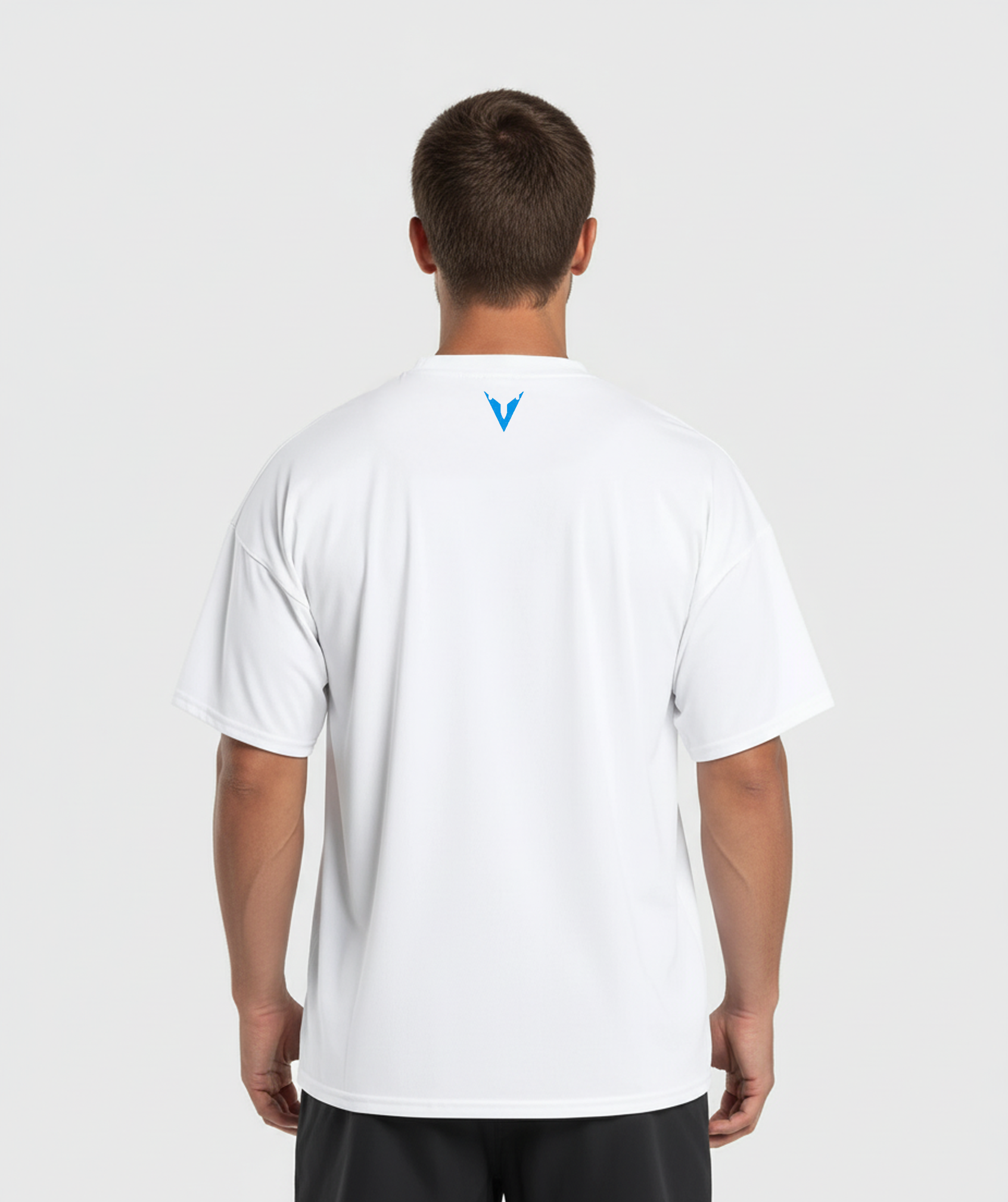 Person wearing a white t-shirt with a logo on the back against a light gray background