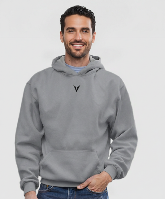 Man wearing a gray hoodie with a logo on a white background