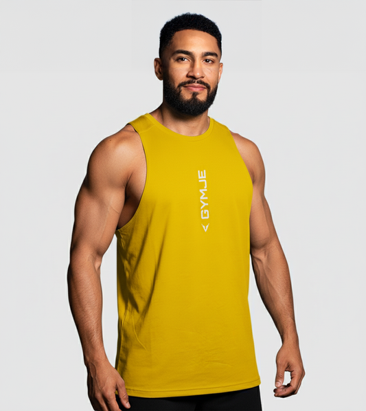 Man wearing a yellow sleeveless shirt with a brand logo on a gray background