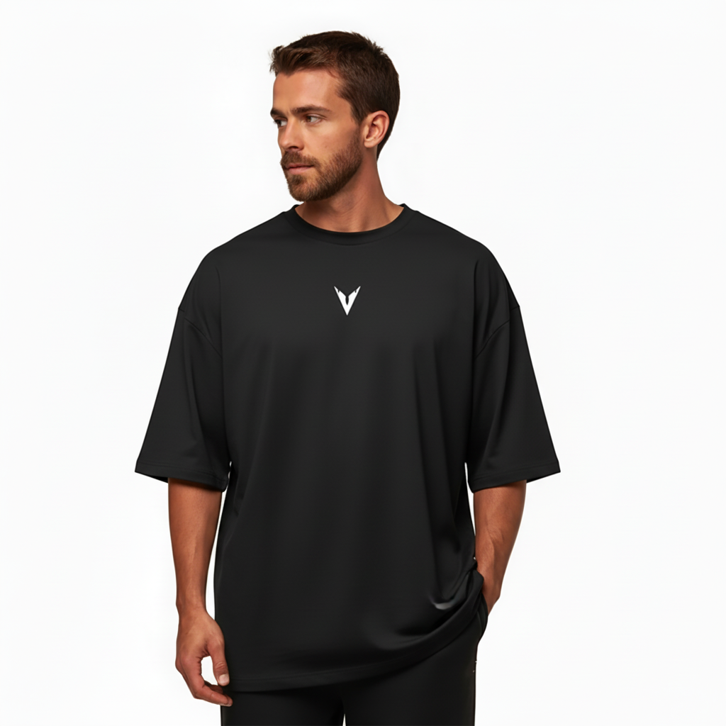 Man wearing a black t-shirt with a logo on a white background